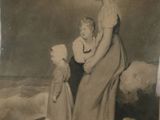 une vieille photo représentant une femme et deux enfants sur la plage