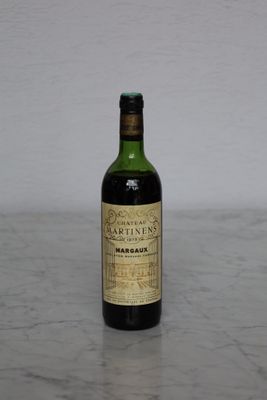 a bottle of wine that is sitting on a table