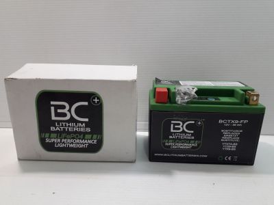 two batteries are sitting next to each other on a table