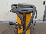an image of a yellow and black vacuum sitting on top of a cart