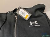 the back of a black hoodie with a white under armour logo on it