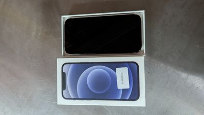 an iphone 12 is sitting in a box on a table