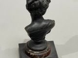 sculpture of a bust of a woman on a marble base