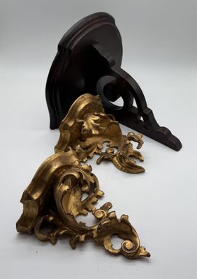 pair of antique bronze figurines of a man and a woman