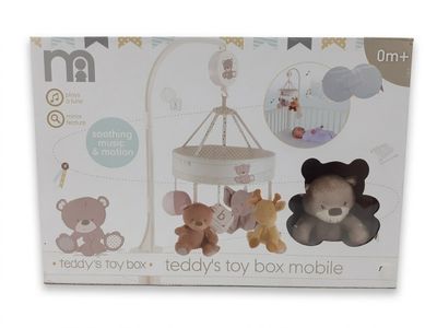une boîte contenant un ours en peluche et d'autres jouets