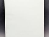 a white piece of paper sitting on top of a table