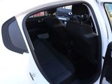 a white car with its door open and a black seat