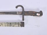 a very old and rusty looking knife on a white surface