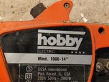 a close up of a chainsaw on a table in a room
