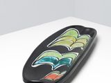 an image of a black plate with a colorful design on it
