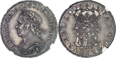 a silver coin with a crown on top of it
