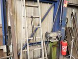 a ladder leaning up against a wall in a garage