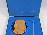 a blue case with a piece of cardboard in it