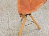 a pair of gloves on a tripod next to a pair of gloves
