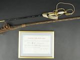 a picture of a gun and a framed picture on the wall