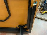 a wooden table with a metal frame on it