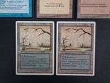 several cards are sitting on top of a table with a black background