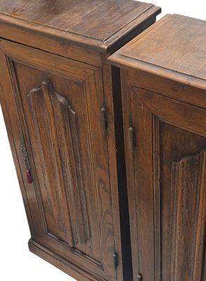 two wooden cabinets that are side by side on a white background
