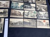 a lot of old pictures of a town on the table