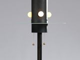 a close up of a lamp that is on a glass table