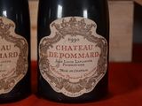 two bottles of wine that are on a table