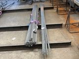 a lot of steel bars that are sitting on the floor