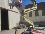 a picture of a man on a cherry picker