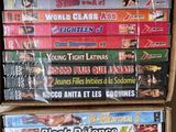 several dvds stacked on top of each other in a box