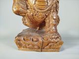 a statue of an elephant that is sitting on top of a table
