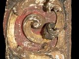 a small decorative object with a spiral design on it