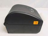an image of a black printer sitting on top of a white table