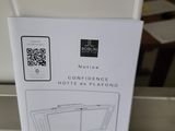 packaging of a white electronic device sitting on top of a metal counter