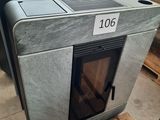 lot of three steel stoves in a warehouse with a price tag on the front