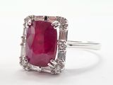 an image of a ruby and diamond ring on a white background