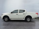 a picture of a white pick up truck parked in a parking lot