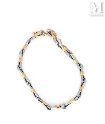 a close up of a bracelet on a white background