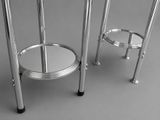 two stools that are next to each other on a table