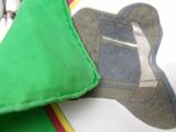 a green umbrella with a picture of a shoe on it