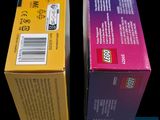two boxes of legos sitting next to each other on a table