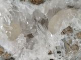 a close up of some ice crystals on a rock
