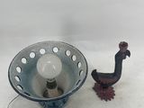 a small bird next to a small bowl on a table