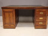 an image of a wooden desk with three drawers and two drawers
