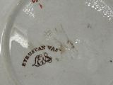 a close up of a plate with a design on it