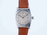 an image of a wrist watch with a brown leather strap