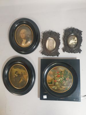 four framed pictures of a man and a woman on the wall