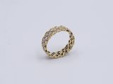 a gold ring with diamonds on a white background
