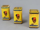 three small tins of bananas are sitting on a table