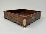 an image of a wooden tray with a decorative design on it