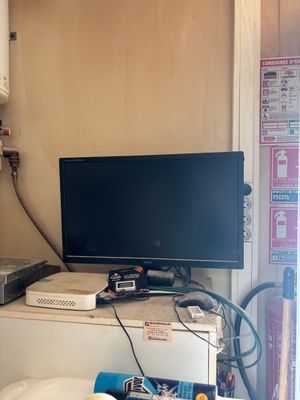 a television sitting on top of a cabinet in a room