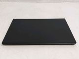 an open laptop computer sitting on top of a white surface